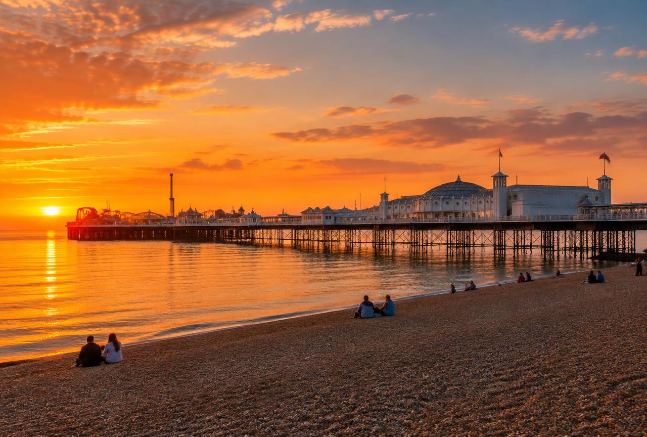 Brighton Palace Pier at sunset over the sea on a private Brighton and Seven Sisters tour