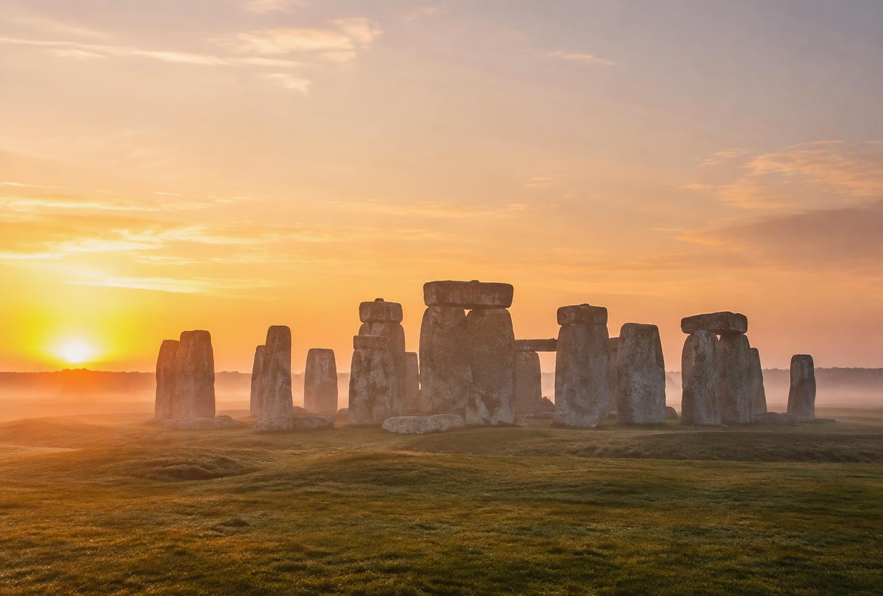 Stonehenge standing stones on Salisbury Plain at low sun on a private chauffeur tour from London